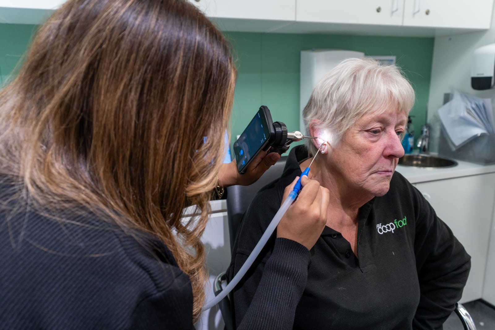 A MediPill pharmacist performing gentle ear microsuction