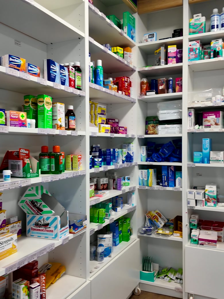 Well-stocked pharmacy shelves at MediPill